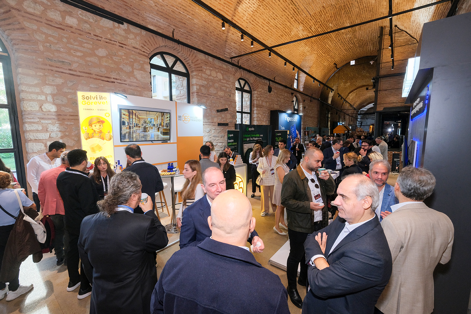 Attendees in the summit exhibition area